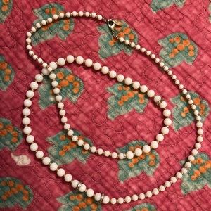 Long white bead and faux crystal necklace